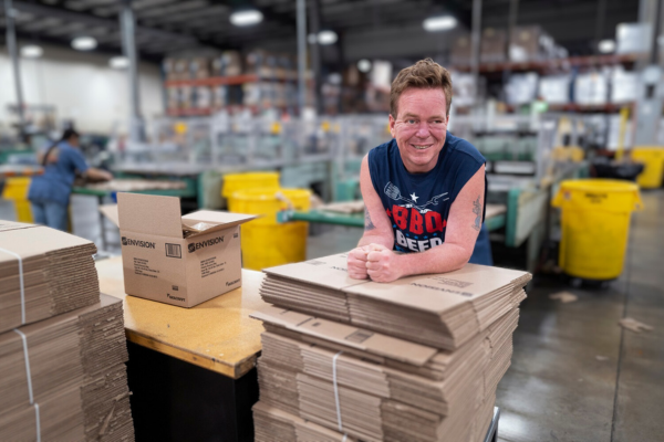 Kelly smiling in the manufacturing facility.