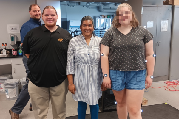 Sarika with a research participant wearing motion sensors.