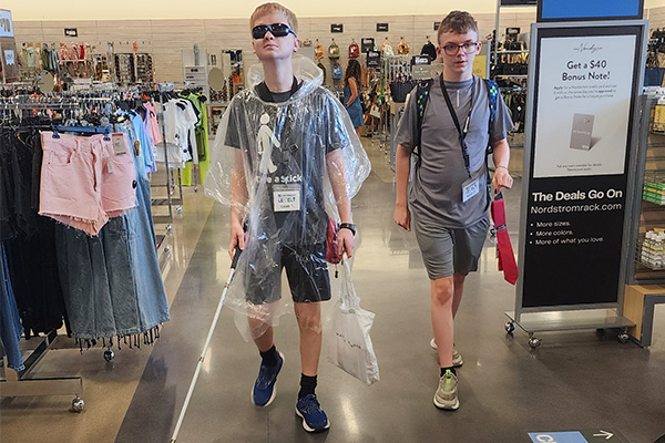 Two participants at Level Up shop at a local clothing store.